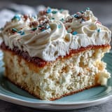 Vibrant vanilla sheet cake with creamy buttercream and Class of 2026 piped in bold school colors, perfect for graduation celebrations.