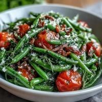 A vibrant dandelion greens salad with zesty lemon vinaigrette and shaved Parmesan for a fresh Mediterranean bite.